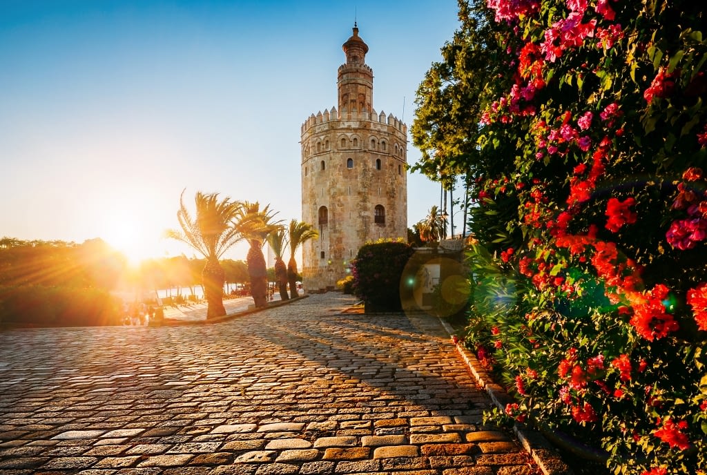 Seville, Spain - July 14th, 2018: Torre del Oro, meaning Golden Tower, in Seville, Spain is an Albarrana Tower located on the left bank of the Guadalquivir River